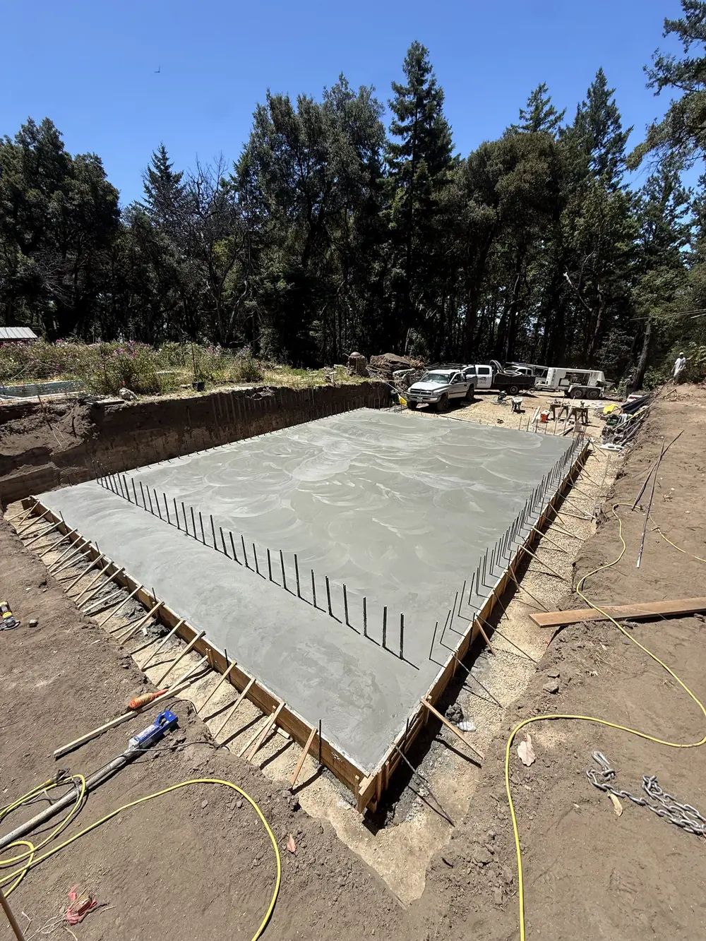 Poured concrete foundation slab with formwork and rebar
